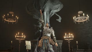 A player in Elden Ring: Shadow Of The Erdtree stands in front of a statue of Marika and holds aloft an Iris Of Occultation in their hand.