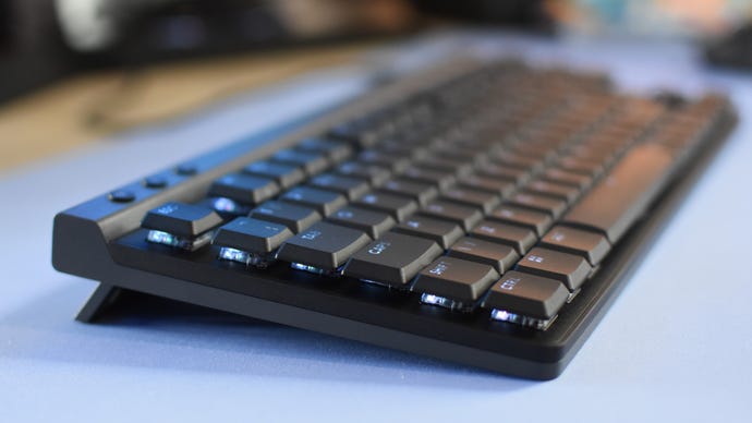 A side view of the Logitech G515 Lightspeed TKL gaming keyboard, showing its low-profile design.