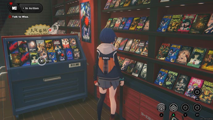 Belle stands in her family video rental store, looking at the tapes.